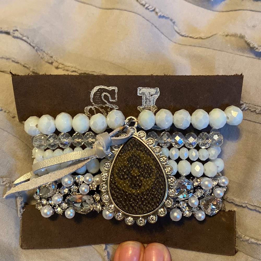 White and silver stack Bracelet set with repurposed L*V*. Paid $45 asking $30